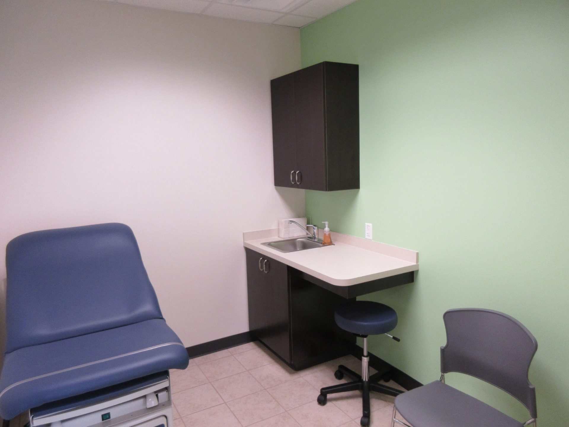 Clermont patient room with a cabinet and patient chair